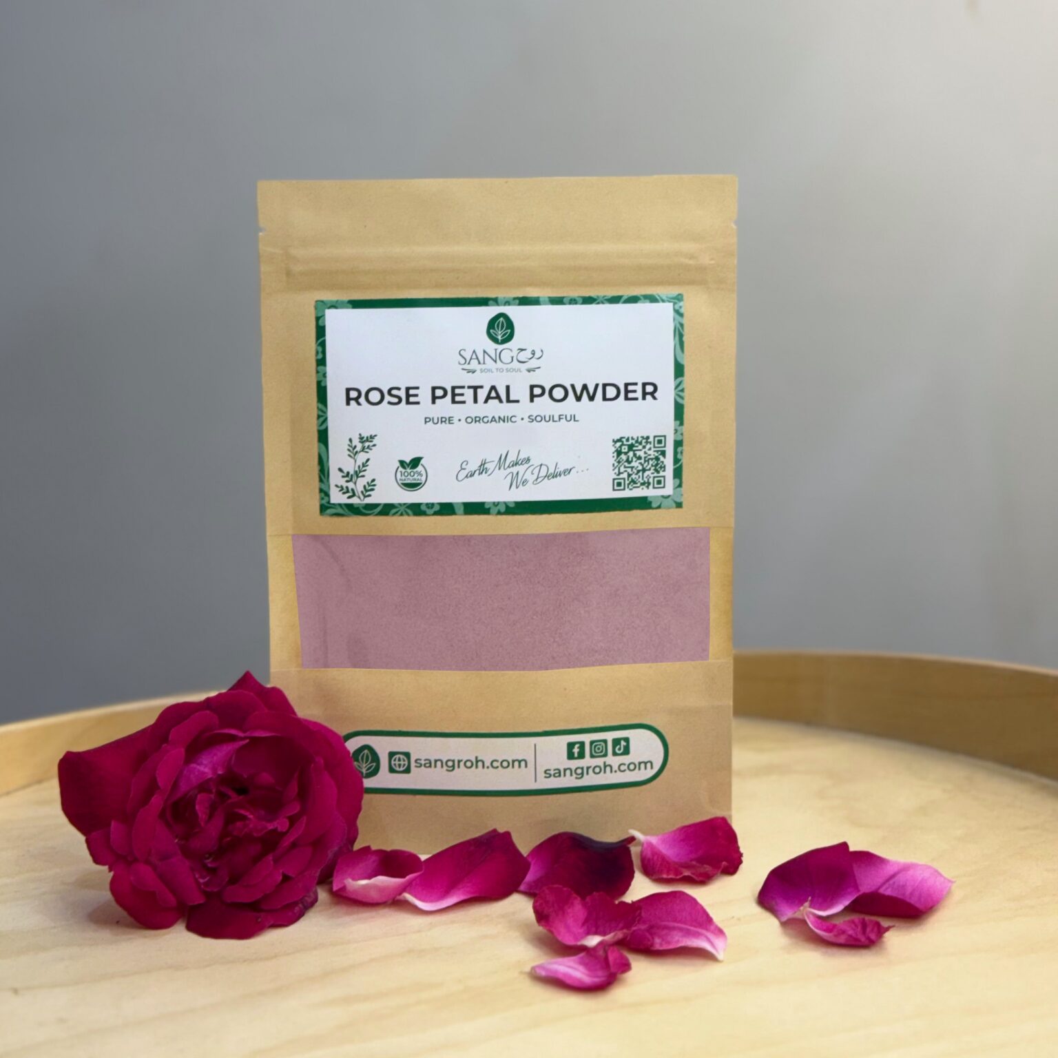 Pure organic rose petal powder in resealable pouch with fresh rose petals for glowing skin, gentle cleansing, and pore care