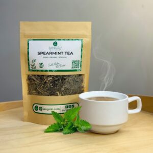 Pure organic spearmint tea leaves in resealable pouch with freshly brewed spearmint tea for digestion and refreshing calm