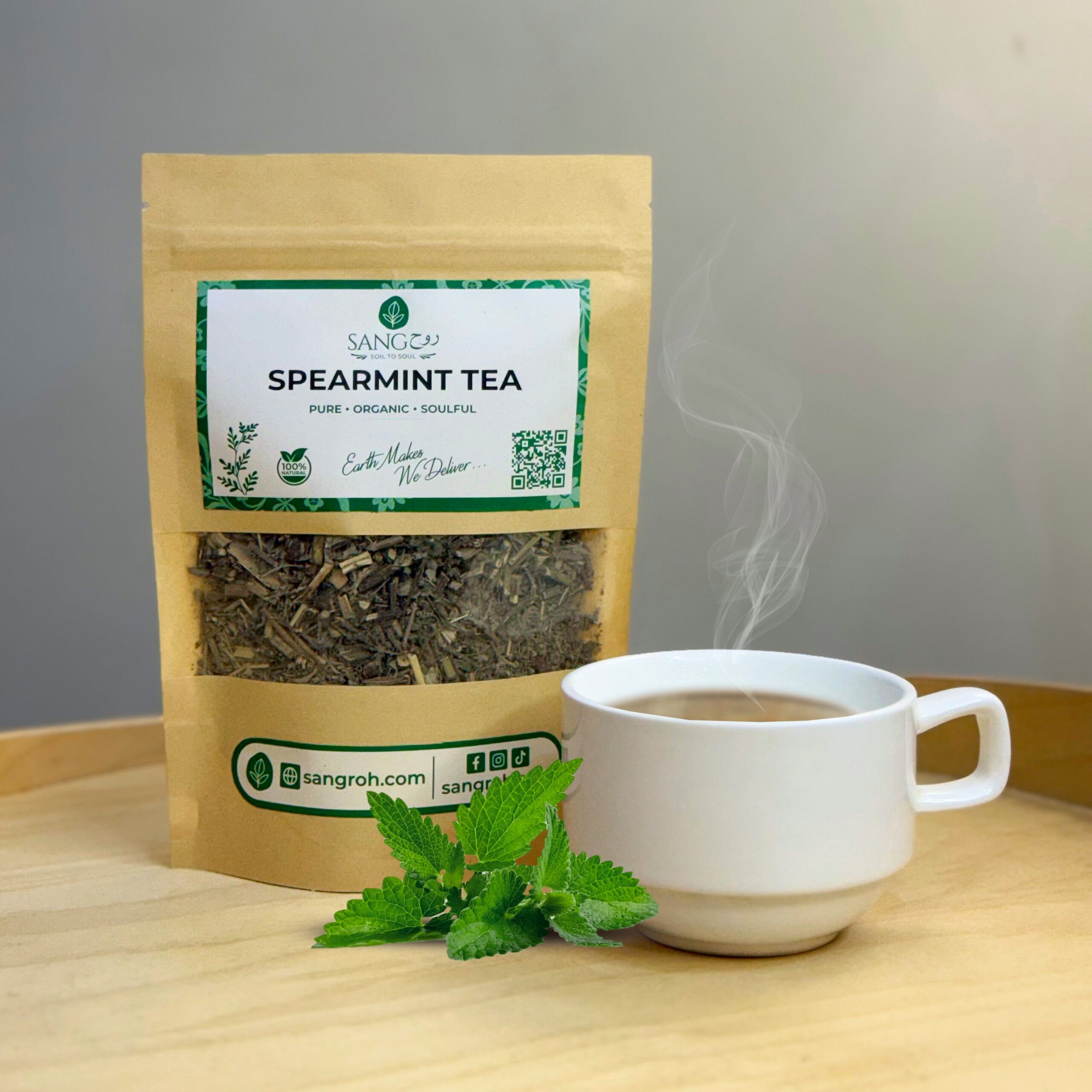 Pure organic spearmint tea leaves in resealable pouch with freshly brewed spearmint tea for digestion and refreshing calm